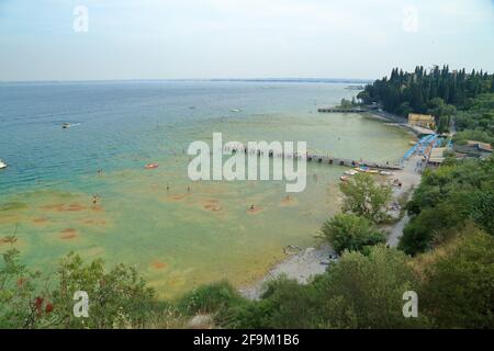Sirmione beach, Lido delle Bionde, Il Pontile di Sirmione. Lake Garda, Lago di Garda, Gardasee, Italy Stock Photo