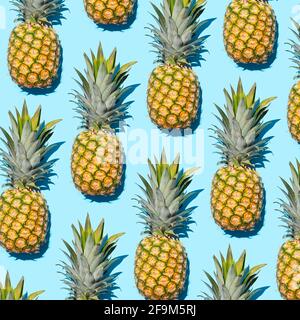 Pineapple pattern on blue background Stock Photo