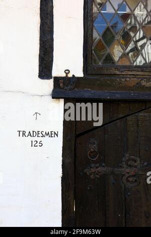 Trademen sign next to entrance of historic timber framed house of Shovells at 125 All Saints Street, Old Town, Hastings, East Sussex, UK Stock Photo