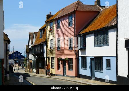 Quaint historic timber houses in All Saints Street in Old Town, looking towards the coast (sea just visible in distance), Hastings, East Sussex, UK Stock Photo