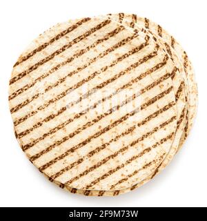 Stack of plain tortilla wraps with grill marks isolated on white. Top view. Stock Photo