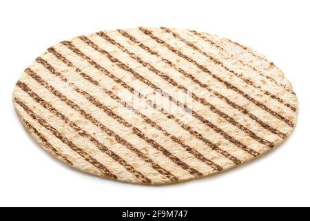 Single plain tortilla wrap with grill marks isolated on white. Stock Photo