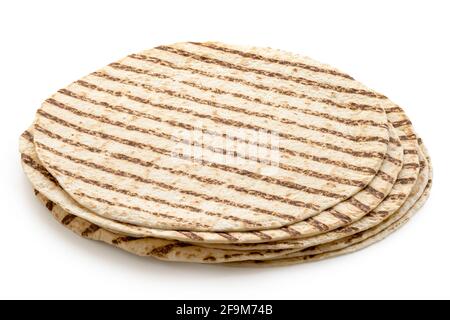 Stack of plain tortilla wraps with grill marks isolated on white. Stock Photo