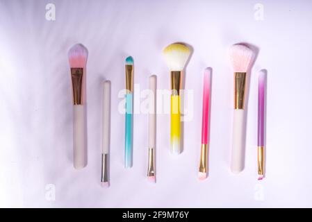 Set of professional colorful makeup brushes in cosmetic bag holder, closeup Stock Photo