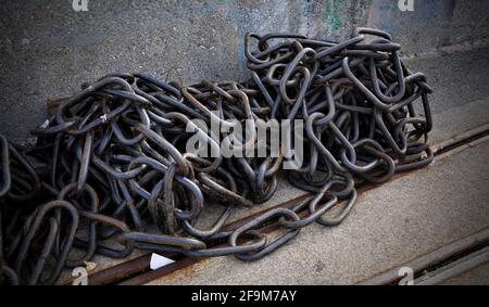 Rusty chain. Close-up photo. Marine equipment. Rusted metallic chains close up.The big ship anchor chains close-up picture Stock Photo