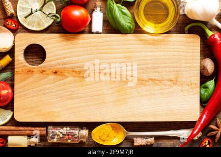 Various herbs and spices on wooden background Stock Photo