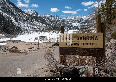Lake Sabrina is a reservoir in Inyo County, CA, USA that is still frozen in the spring each year. Stock Photo