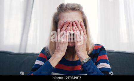Elderly woman suffering from headache. High quality photo Stock Photo