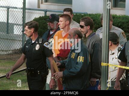 Oklahoma City, OK, USA. 17th Apr, 2001. Alleged Oklahoma city bomber TIMOTHY MCVEIGH, 27, is led by law enforcement out of the Noble County Courthouse in Perry, Oklahoma on April 21, 1995 following his arrest in the bombing of the Murrah Federal Building two days earlier. McVeigh was put to death on June 11, 2001 after being convicted of the crime. Credit: Bob Daemmrich/ZUMA Wire/Alamy Live News Stock Photo