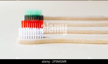 Four multi-colored bamboo toothbrushes . Eco friendly stuff concept. Copy space. Horizontal orientation. Selective focus. Stock Photo
