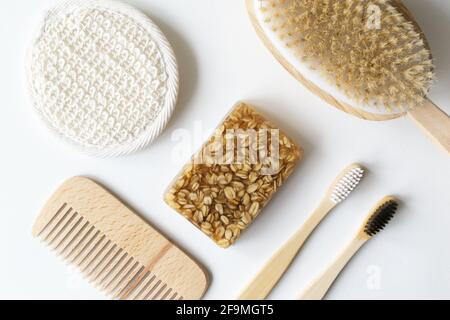 Bamboo toothbrushes, wood hairbrush, face wash, natural bristle brush and handmade oatmeal soap. Eco friendly stuff concept. Horizontal orientation. T Stock Photo