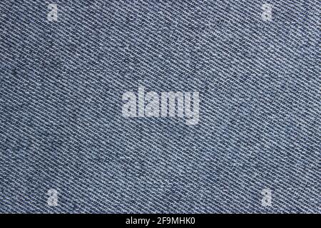 Close-up blue denim texture. Blue jeans texture for background. Texture of blue jeans as background, close up. Stock Photo