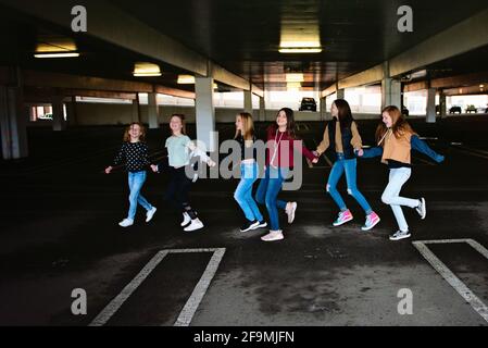 Group of 6 cute Tween girls hanging out having fun in the city Stock ...