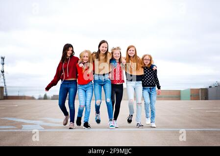 Group of 6 cute Tween girls hanging out having fun in the city Stock ...