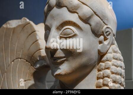 Closeup of an ancient sphinx in Grecian ruins - a treacherous and merciless mythical creature with the head of a human and the body of a winged lion w Stock Photo