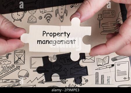 Business, Technology, Internet and network concept. Young businessman working on a virtual screen of the future and sees the inscription: Property man Stock Photo