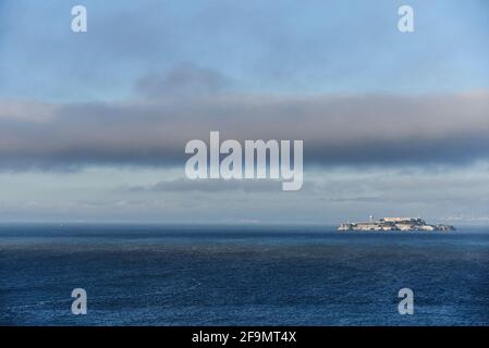 View over Alcatraz island from Golden Gate Bridge with dramatic clouds Stock Photo
