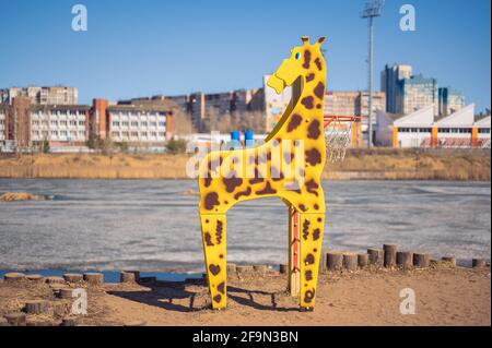 Moscow, RUSSIA - APRIL 18, 2021 playground. basketball hoop in the form of a giraffe. element for games on the playground for kids Stock Photo