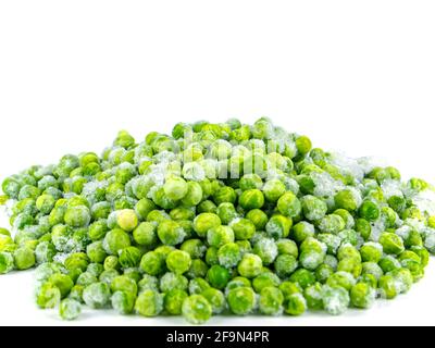 Frozen green peas vegetable on a white plate. Stock Photo
