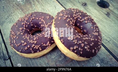 chocolate donuts on a wooden background Stock Photo