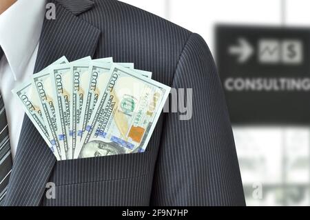 Money - United States dollar (or USD) banknotes in businessman suit pocket - financial consulting concept Stock Photo