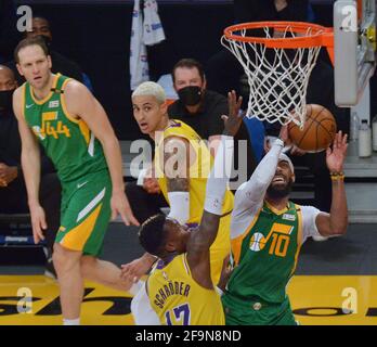 Los Angeles, Unites States. 20th Apr, 2021. Utah Jazz guard Mike Conley (10) scores on Los Angeles Lakers' guard guard Dennis Schroder (17) during the second half of their NBA game at Staples Center in Los Angeles on Monday, April 19, 2021. The Jazz defeated the Lakers 111-97. Photo by Jim Ruymen/UPI Credit: UPI/Alamy Live News Stock Photo