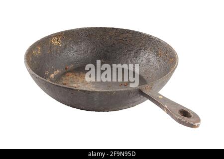 old disgusting stained rusty cast iron pan with burnt fat and food leftovers isolated on white background Stock Photo