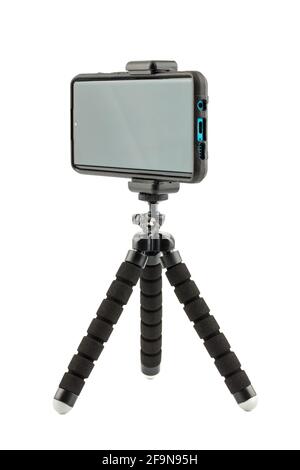 black cellphone in rugged rubber protective cover on small flexible tripod isolated on white Stock Photo