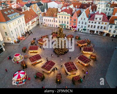 Tallinn, Estonia - December 9 2020: Aerial view to Christmas market in Old Town. Medieval houses with red roofs