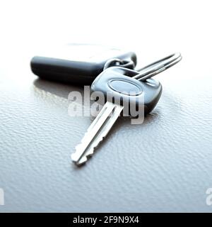Car key with remote control key ring on gray leather texture Stock Photo