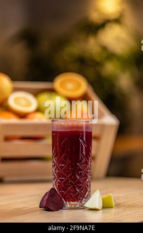 Healthy beetroot and apple juice on wooden table, blurred background Stock Photo