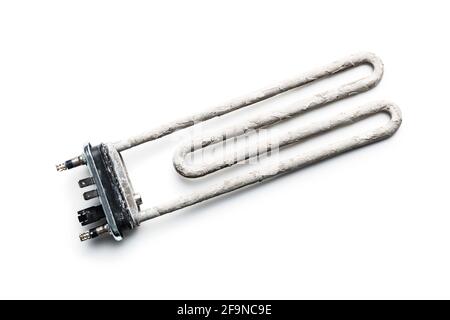 Old washing machine heater with limescale isolated on white background. Stock Photo