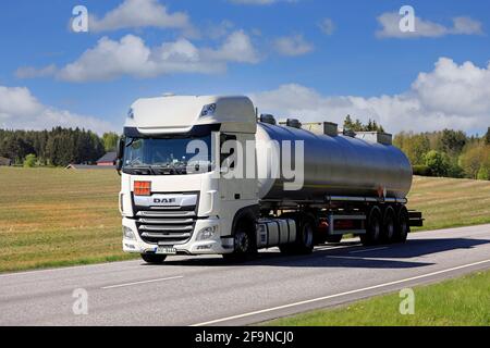 White DAF XF semi tanker truck hauls ADR 33-1987 Alcohols N.O.S. dangerous goods along highway in the spring. Salo, Finland. May 17, 2019. Stock Photo