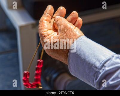 Male hand holding worry beads Stock Photo