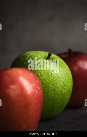 three apples on a dark background Stock Photo