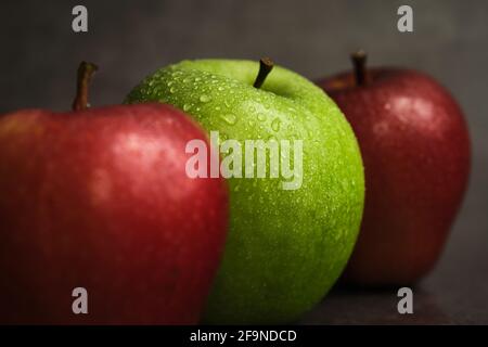 three apples on a dark background Stock Photo