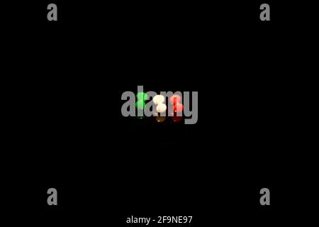 Italy flag like plastic Head Push Pins Thumbtacks isolated on black with reflections Stock Photo