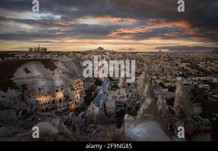 Beautiful scenes in Goreme national park, Cappadocia, Turkey. Colorful hot air balloons flying in the sky on sunset. Incredible rock formations Stock Photo