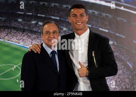 File photo dated November 07, 2016 of Cristiano Ronaldo and Real Madrid's president Florentino Perez during the renews of Cristiano Ronaldo's contract with Real Madrid until 2021 at Santiago Bernabeu Stadium in Madrid, Spain. The European Super League was created 'to save football', says Real Madrid president Florentino Perez. Real are one of the 12 European clubs who have signed up to the breakaway league and intend to establish a new midweek competition. Perez said the move had been made because young people are 'no longer interested in football' because of 'a lot of poor quality games'. Pho Stock Photo
