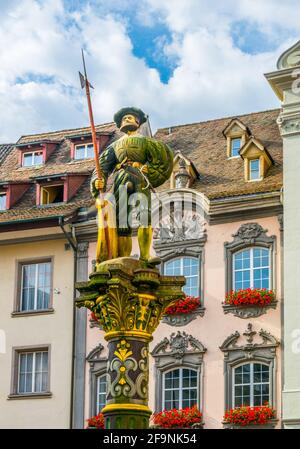 Statue of a swiss guard situated on the top of a fountain on the Fronwagplatz square in the swiss city Schaffhausen. Stock Photo