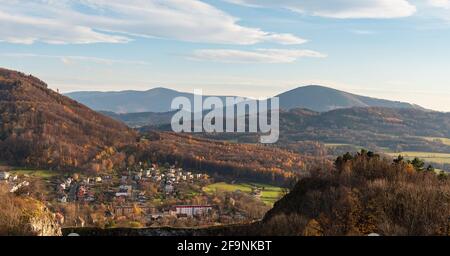 View from hiking trail bellow Bila hora hill summit above Koprivnice town in Czech republic with Radhost and Velky Javornik hills during late autumn d Stock Photo