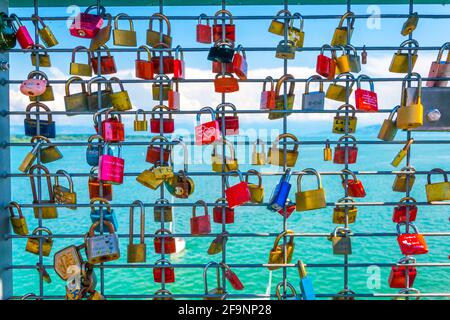 Love locks hanging on a lookout tower in friedrichshafen, germany. Stock Photo