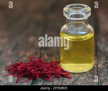 Closeup of Saffron with extract in a bottle Stock Photo