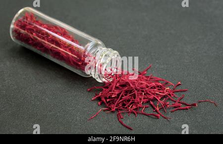 Closeup of Saffron with extract in a bottle Stock Photo