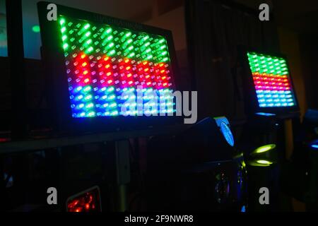 panels with diode lamps of different colors against dark background Stock Photo