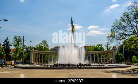 A fountain with a large sculpture of soldiers on a stele on the Soviet memorial monument in Vienna / Russians monument Vienna Stock Photo