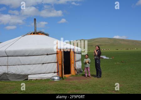 Mother and child at an authentic nomadic ger camp on the steppes of the Orkhon Valley area of Mongolia, Central Asia. Stock Photo