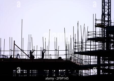 The group of workers working at a construction site. Stock Photo