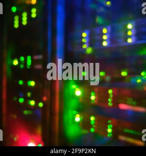 Blurred background of internet service provider server equipment, bokeh of lights of computers and network routers Stock Photo