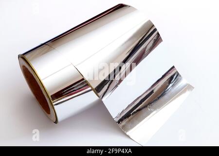 Roll of aluminium foil on white background Stock Photo